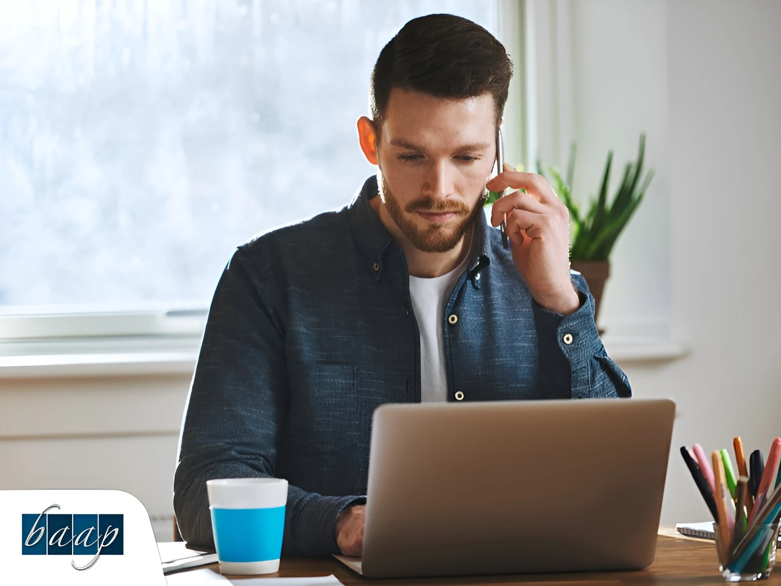 Entrepreneur considering business entity choice for tax and growth planning looking at a laptop